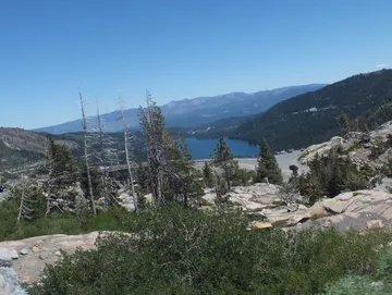 A wedding in Tahoe with the lake in the backdrop along the rugged rocks