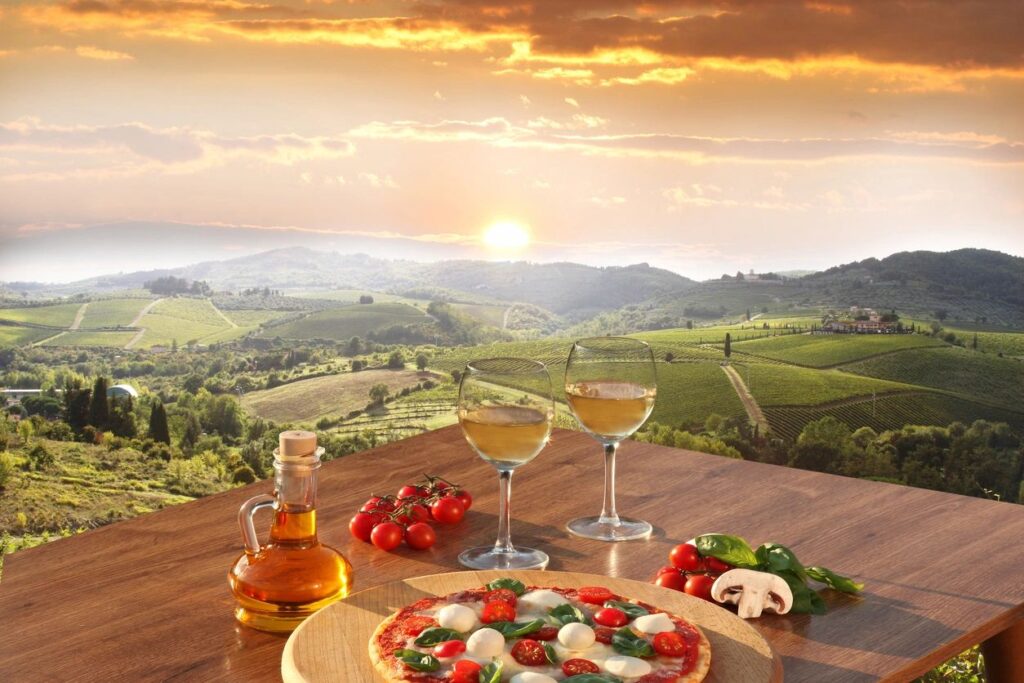 A Nappa Valley wedding with the vineyards in the background and the sun glowing through the clouds